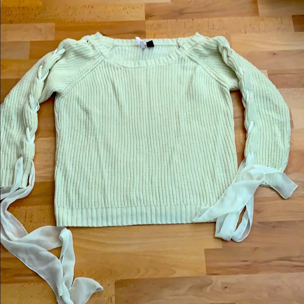 Sweater with braided arms